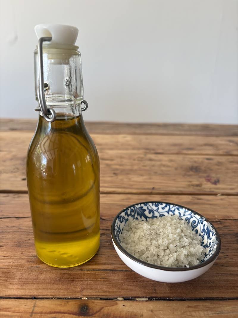 Olive oil and Celtic salt on the wooden counter